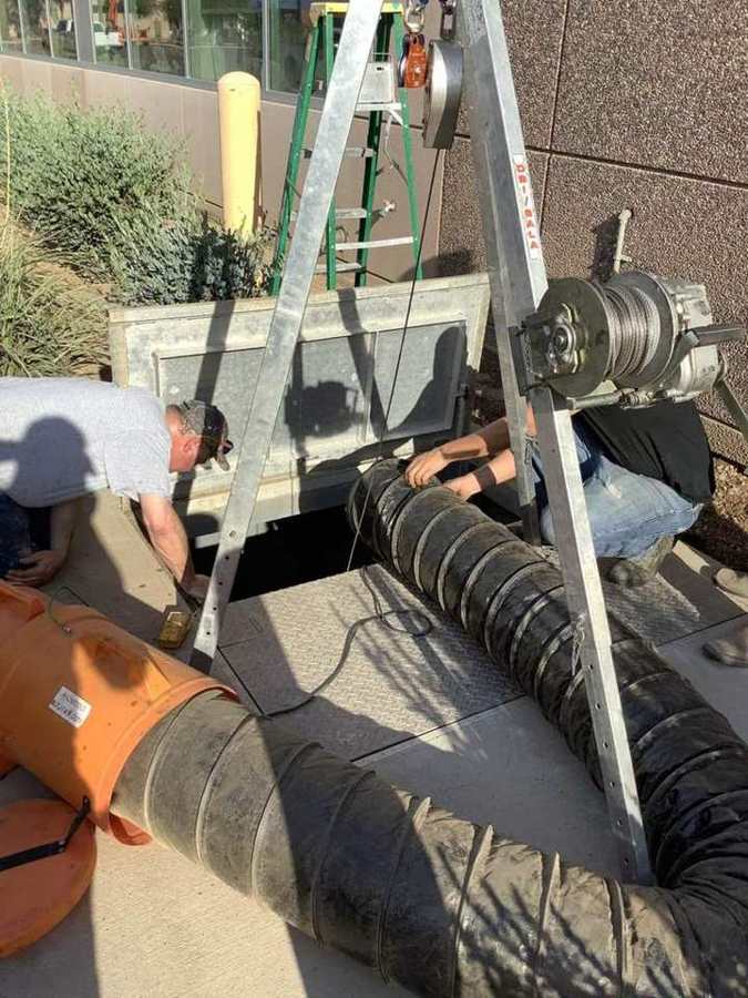 Confined-space entry with a tripod and forced-air ventilation