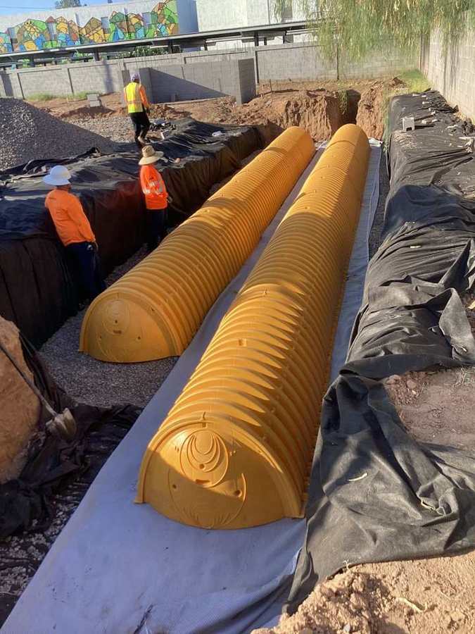 Crew setting underground retention chambers