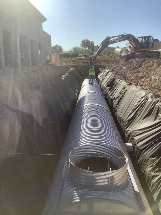 Large-diameter CMP storm drain in trench