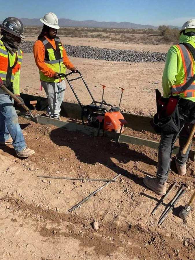 Crew compacting subgrade