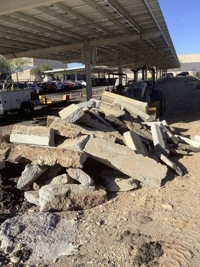 Broken-out concrete staged for haul-off