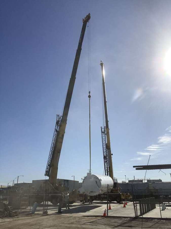 Crane setting a process tank