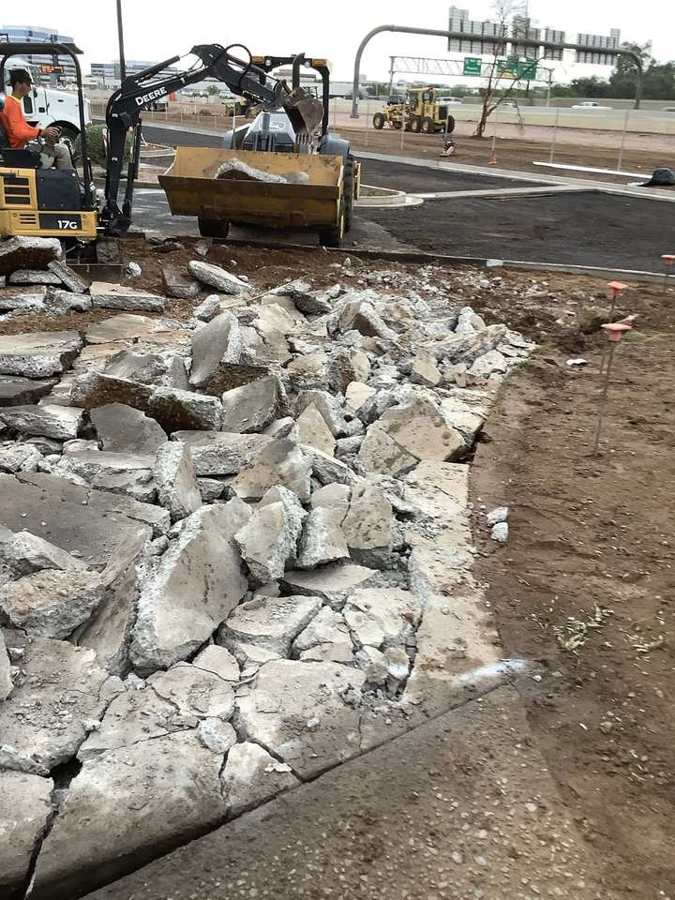 Curb and sidewalk demo with a mini excavator