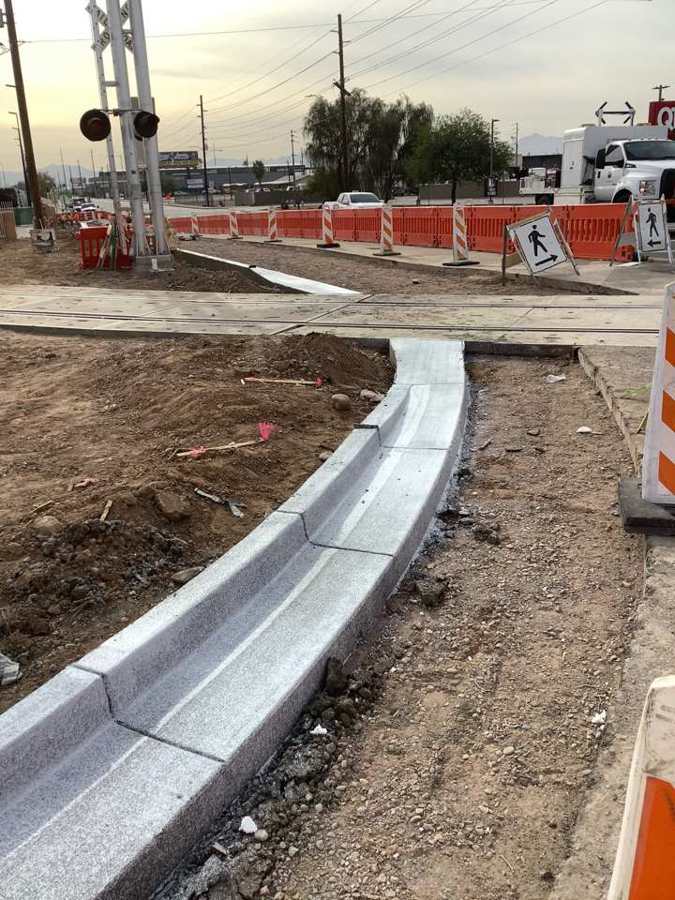 New curb and gutter at a railroad crossing