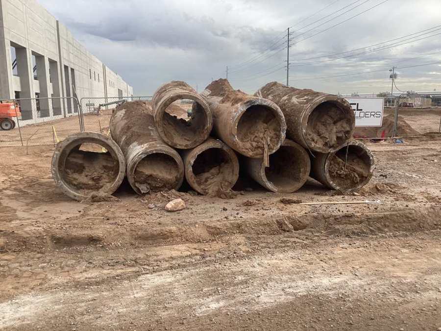 Old concrete irrigation pipe removed from the line