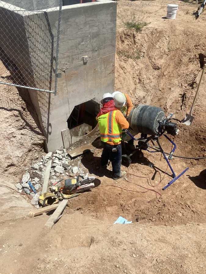Coring a pipe opening in an irrigation structure
