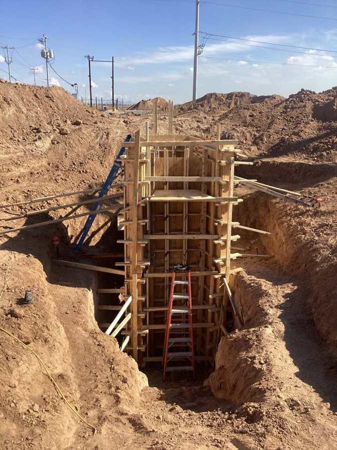 Irrigation structure formed and braced in the excavation