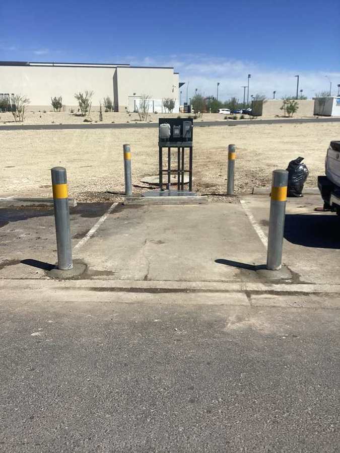 Lift station control panel with protective bollards