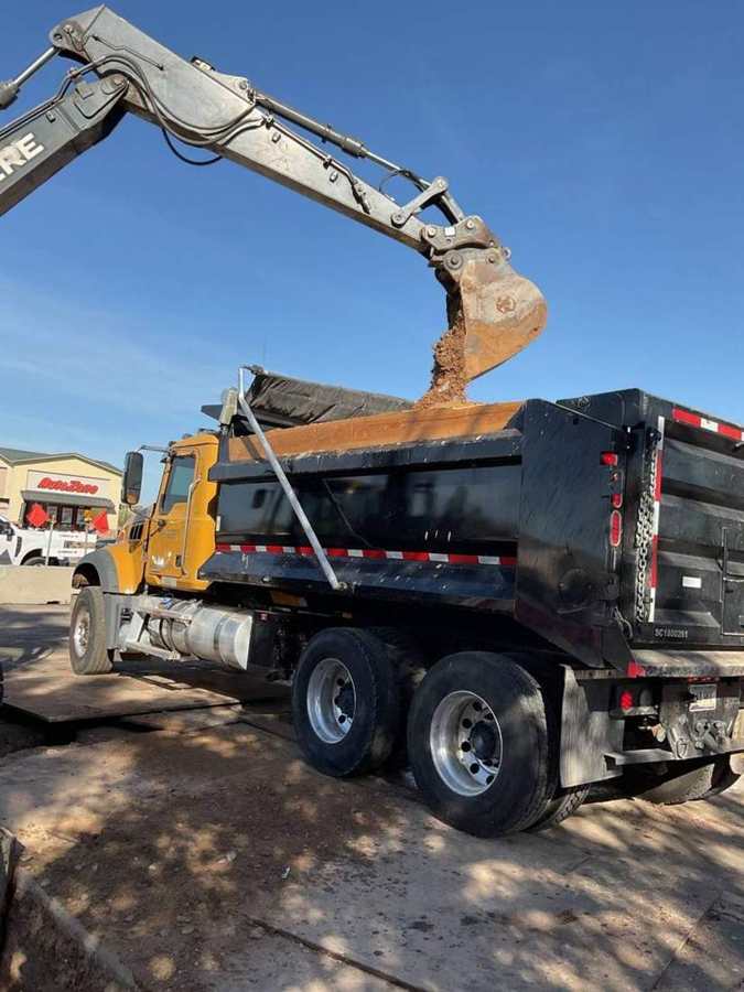 Excavator loading a dump truck