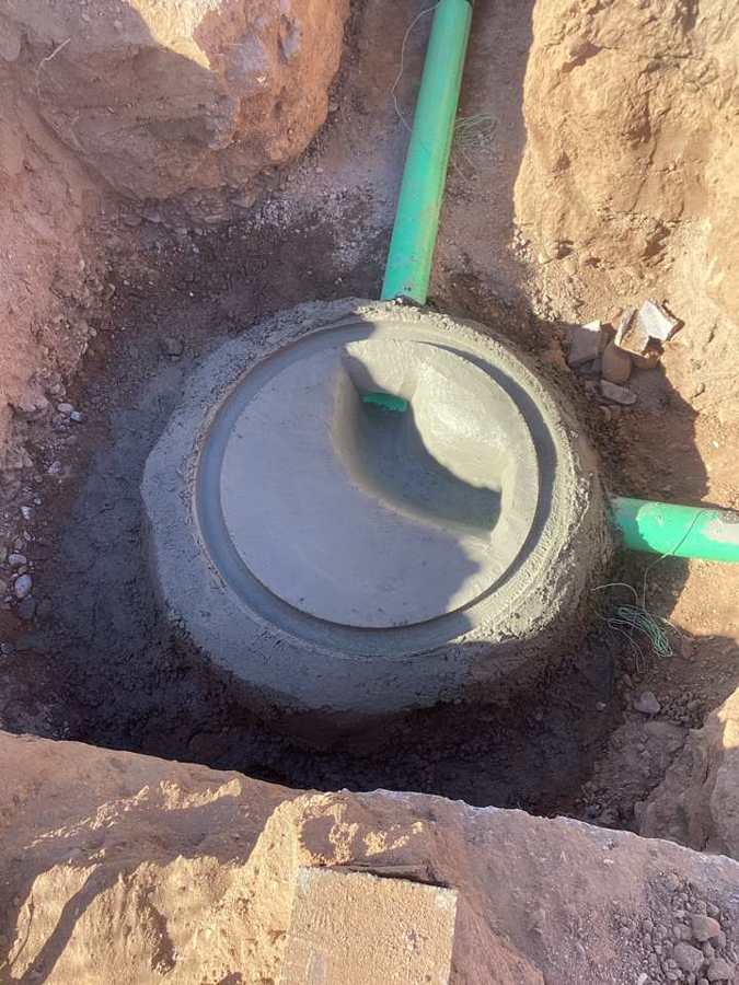 Manhole base poured with channels formed