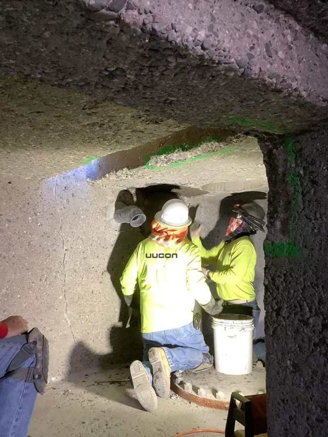 Overhead concrete repair inside a plant channel