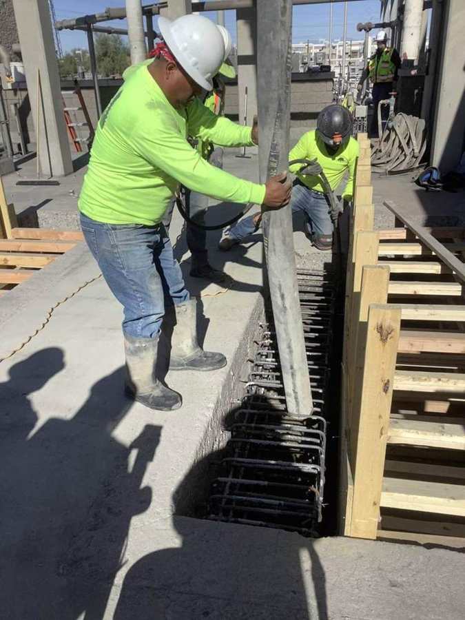 Placing concrete in channel wall forms