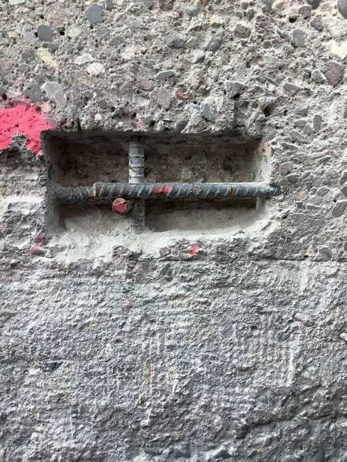 Exposed rebar prepped for structural repair