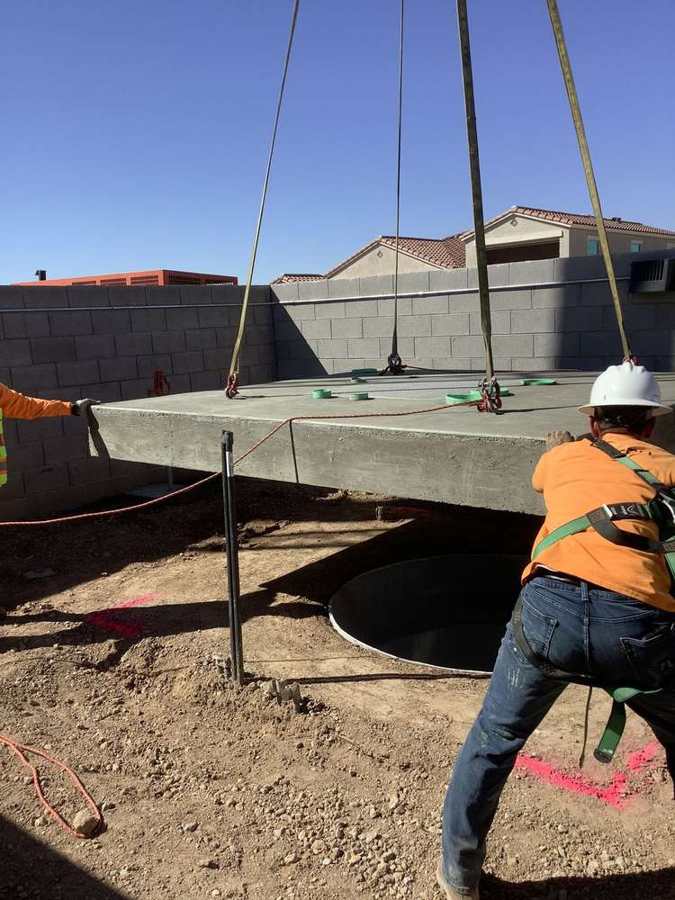 Setting a precast vault lid by crane