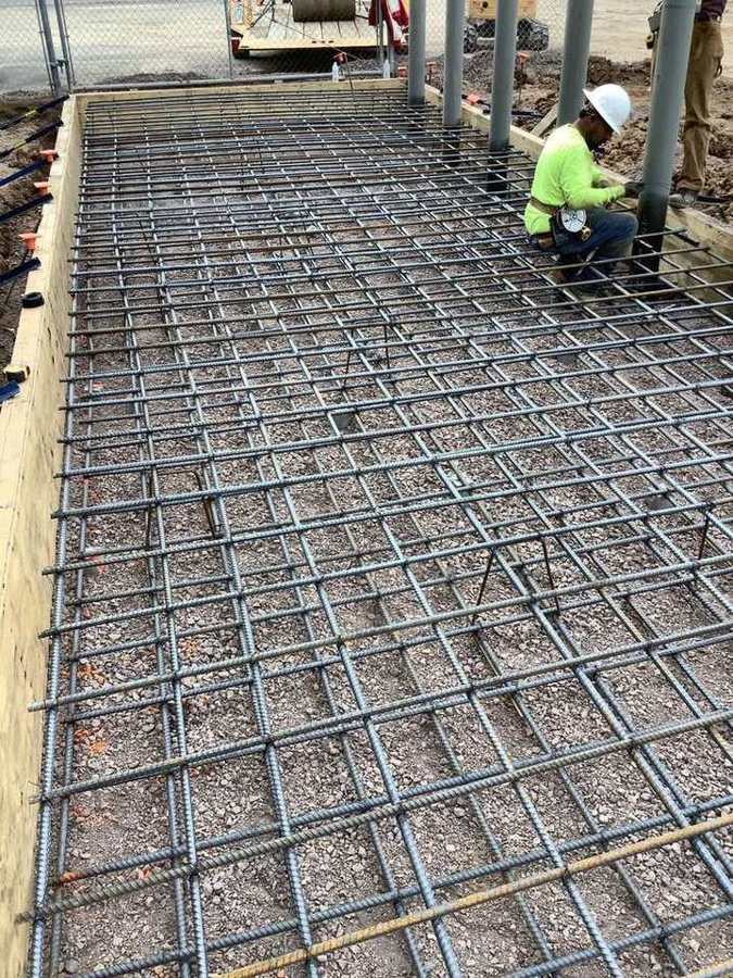 Tying a rebar mat before the pour