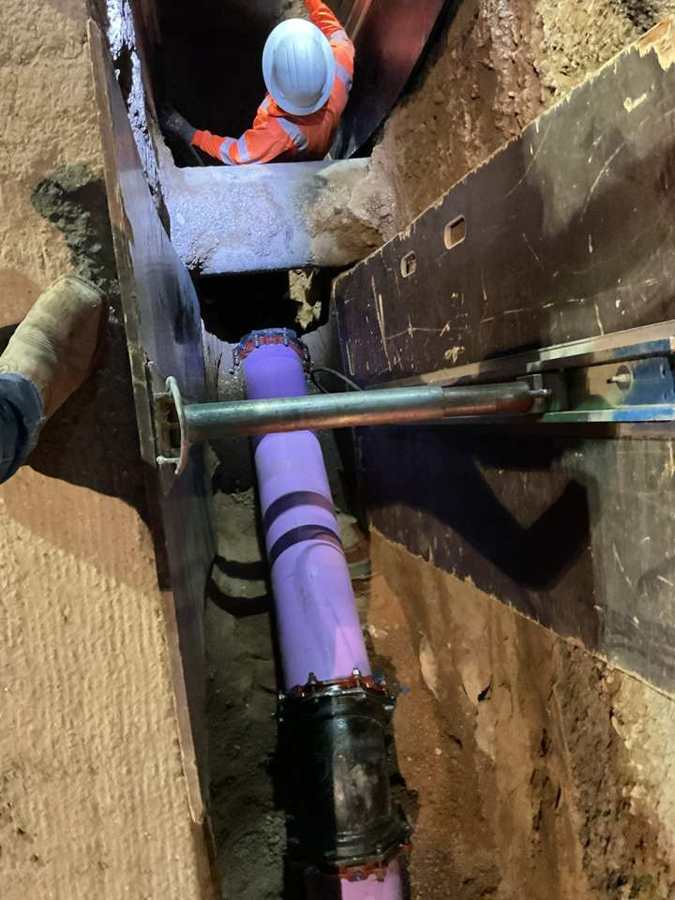 Reclaimed water main in hydraulic shoring
