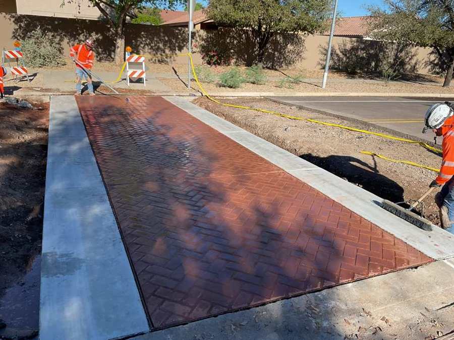 Crew finishing a stamped median